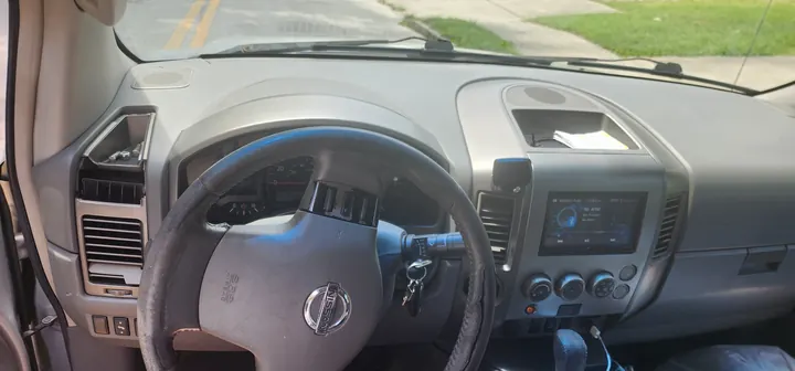 Current driver cabin showing the dashboard and steering wheel wear