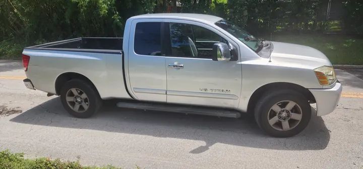 Passenger-side profile showing the Titan body and bed